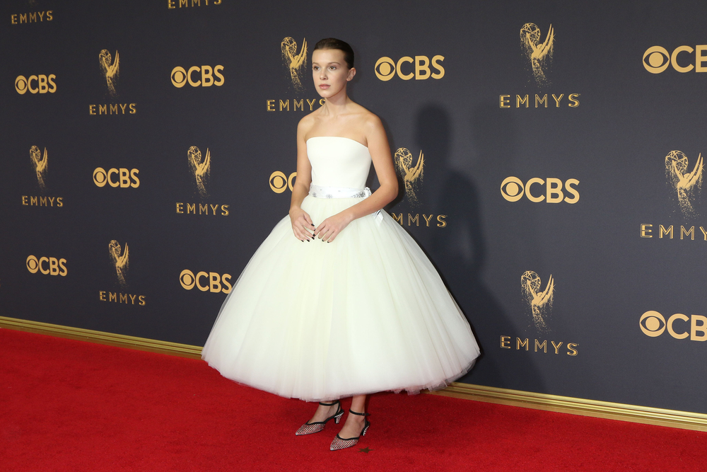 Millie Bobby Brown at the 69th Annual Emmy Awards wearing a white dress