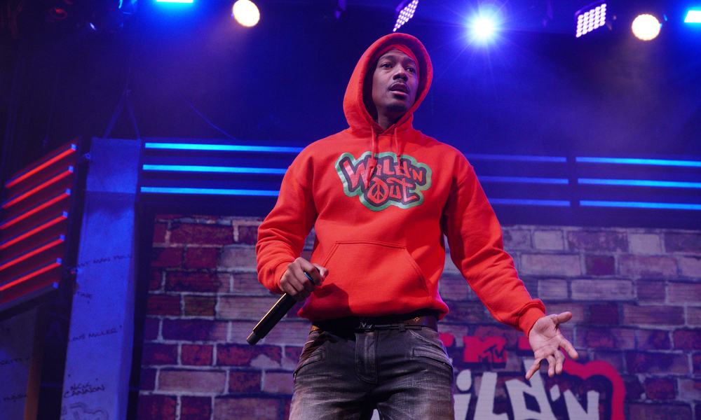 Nick Cannon wearing a read Wild N Out sweatshirt during the MTV Wild n Out Tour at the Amway Center in Orlando Florida