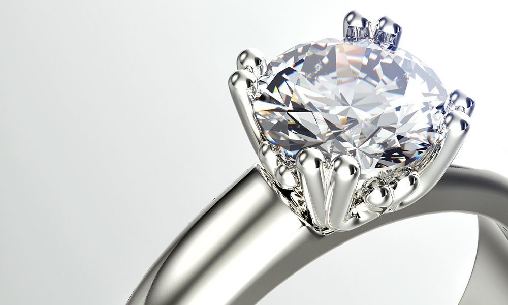Close-up photo of a wedding ring with a large diamond.